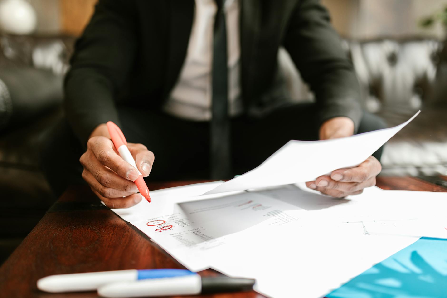 man working with documents on table